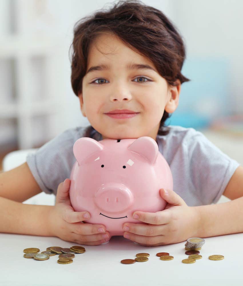 little boy with piggy bank