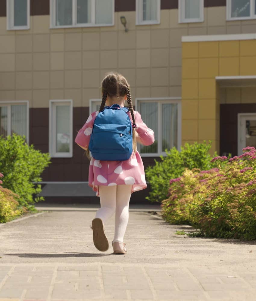 Little girl walking into preschool