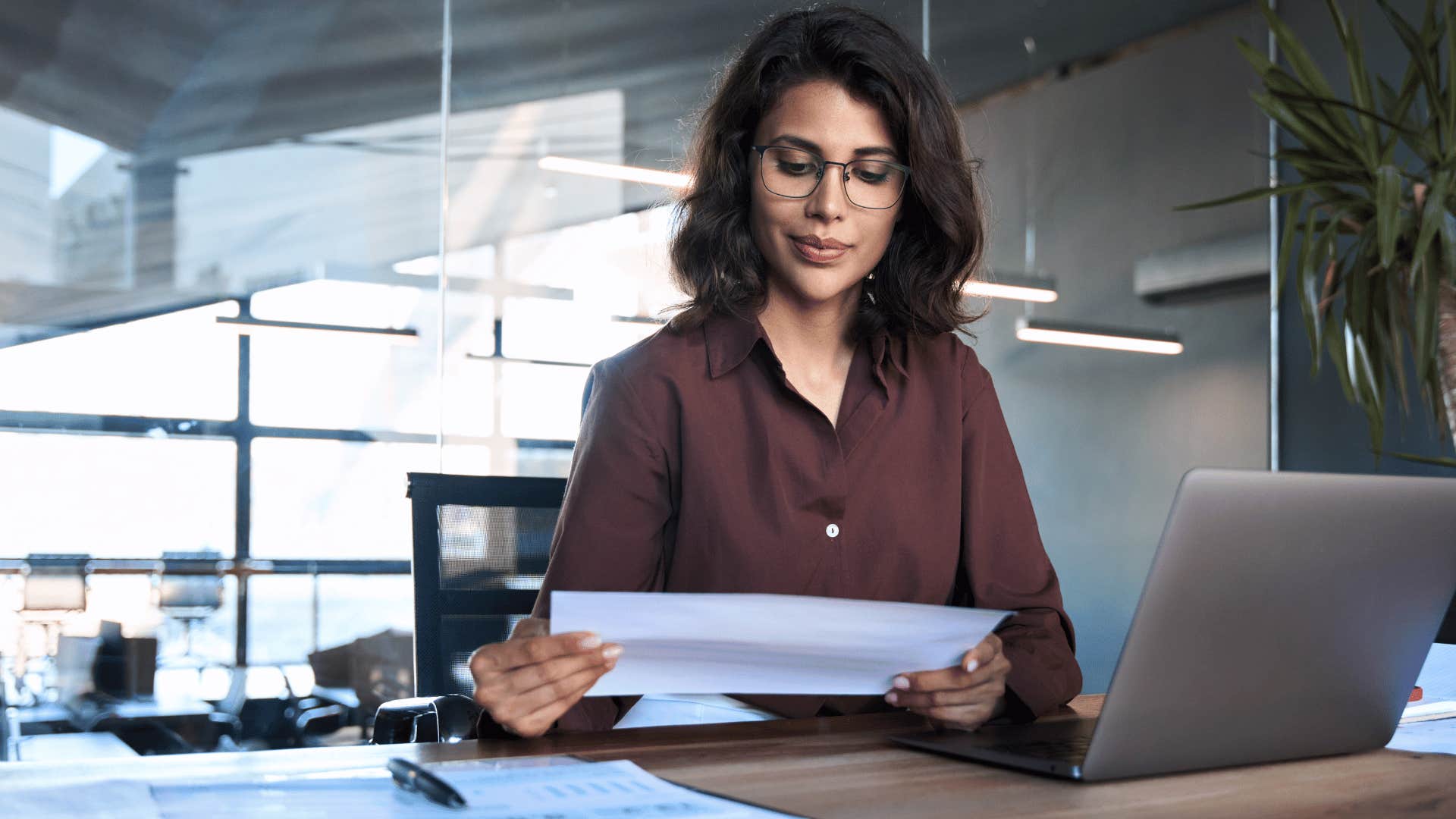 woman looking at paper 