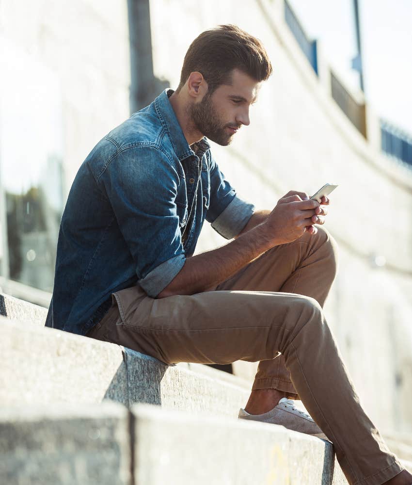 man checking his text messages