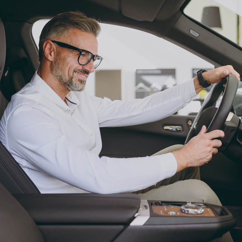 Man sitting in his married couple's car. 