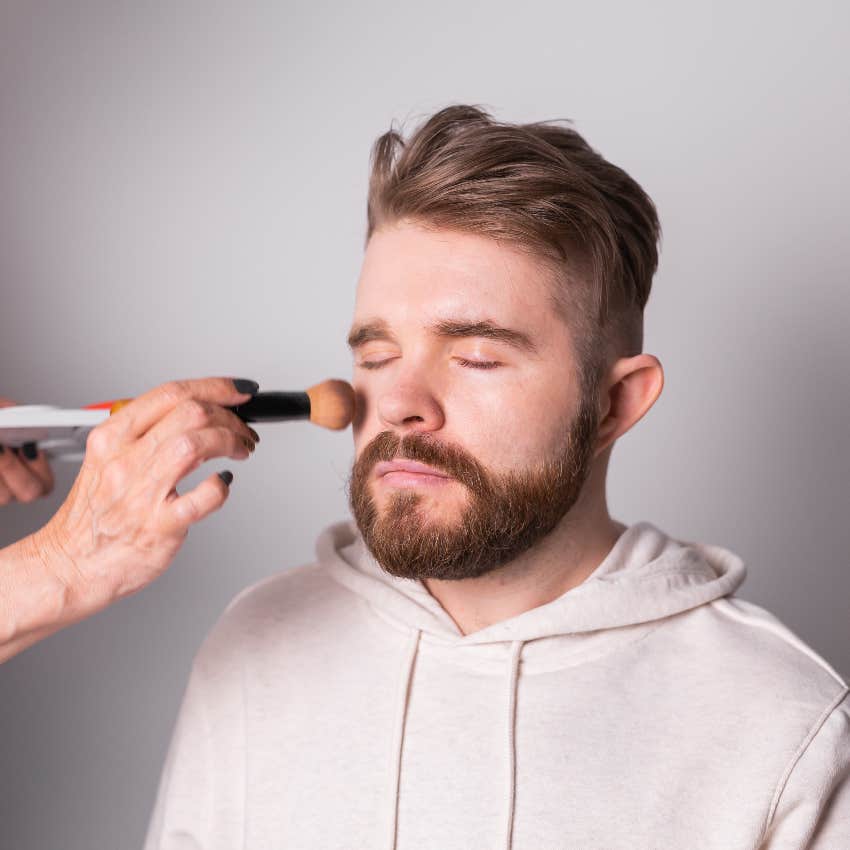 Fiancé getting makeup done for the ceremony