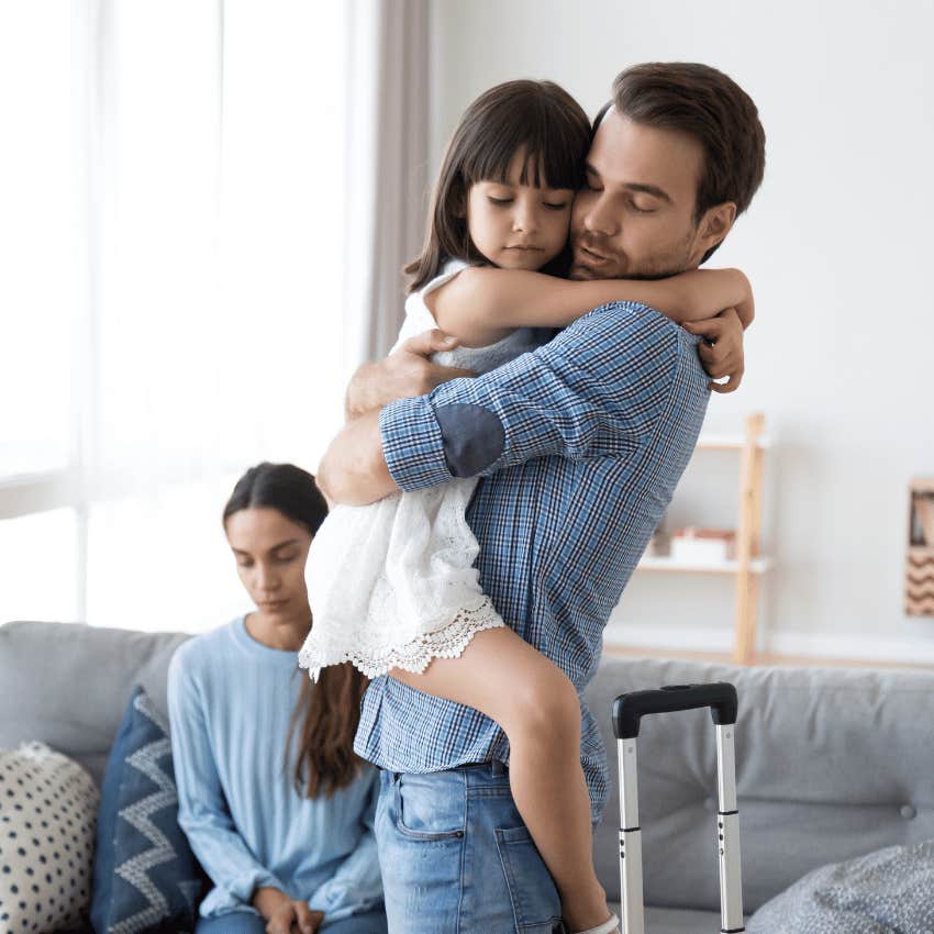 man hugging young child