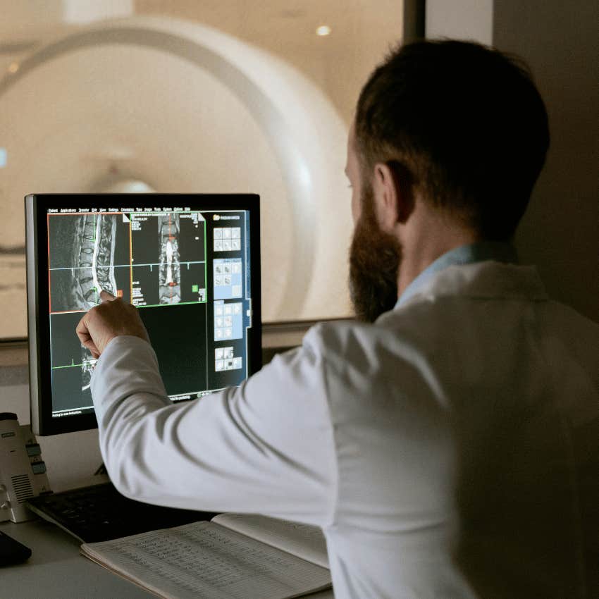 man pointing at medical imaging