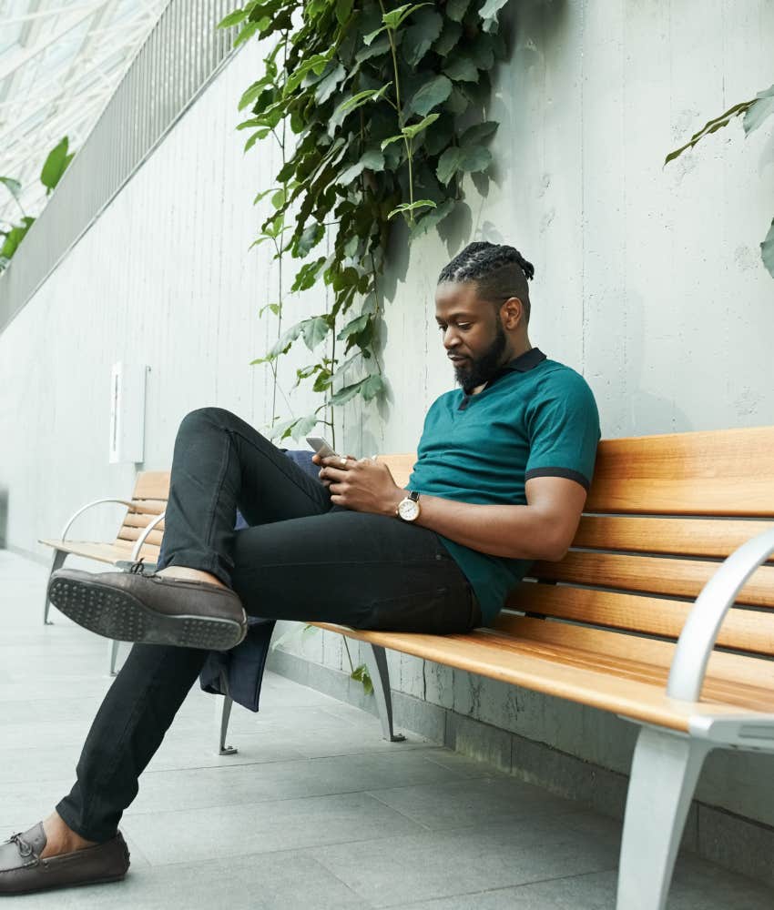 man sitting alone on a bench