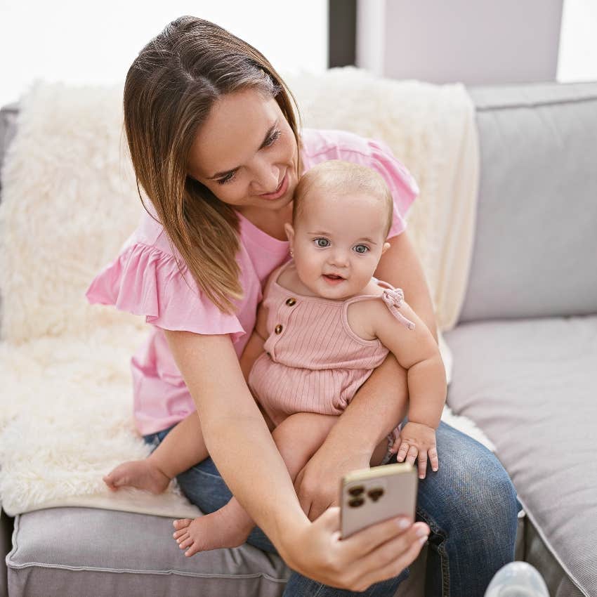 Mom taking a selfie with her baby to post