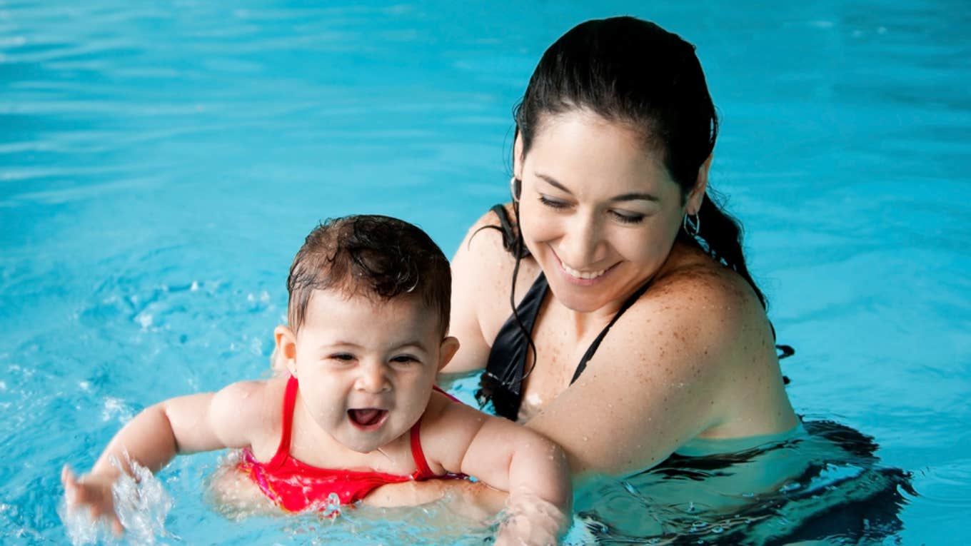 mom at swim lesson with baby