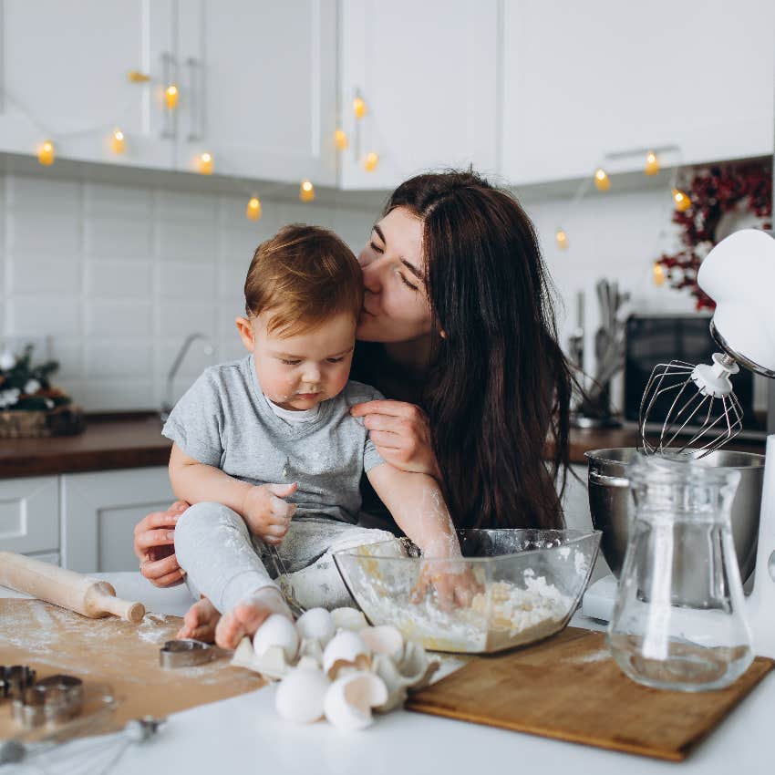 Working mom making potluck dish with her toddler