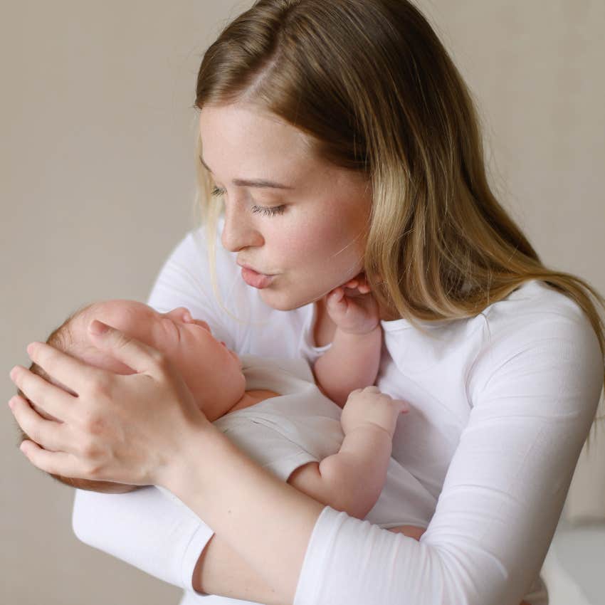 Mom soothing crying newborn baby