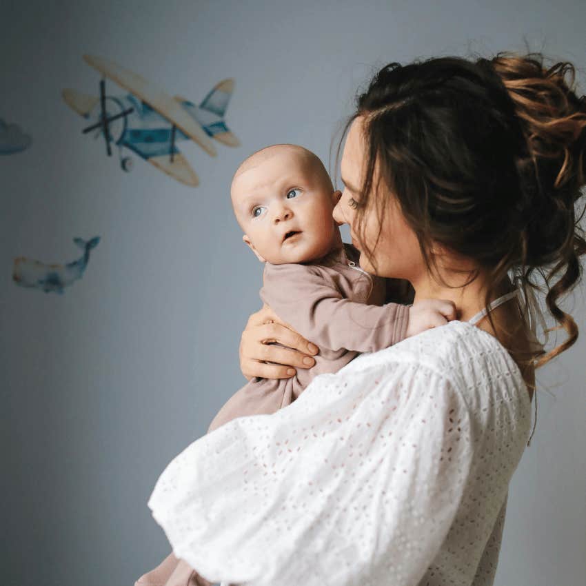 mother holding baby