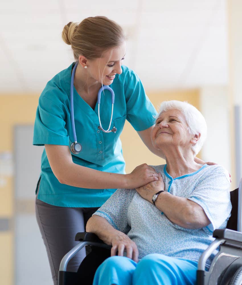 nurse helping elderly patient