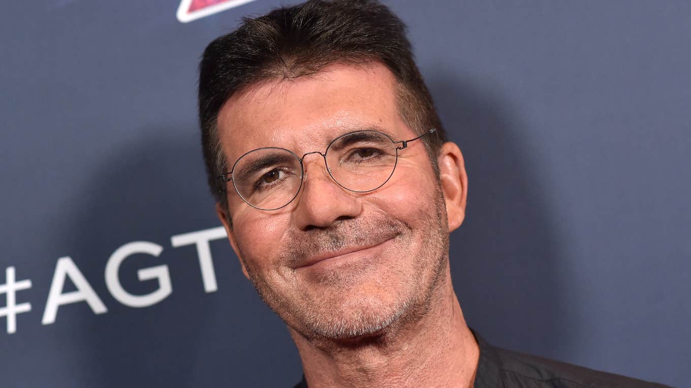 Simon Cowell wearing glasses on red carpet