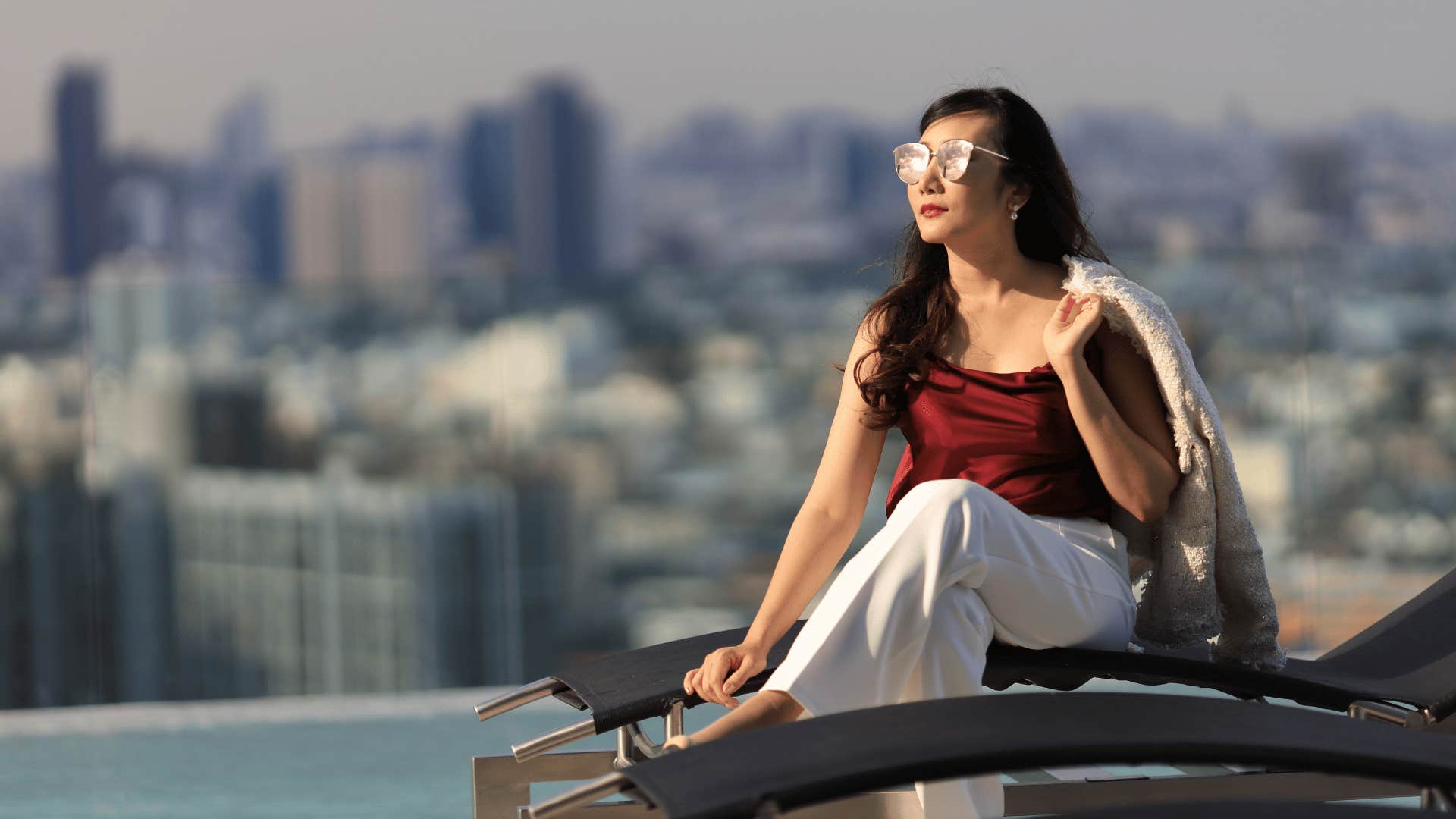 woman sitting on roof deck 