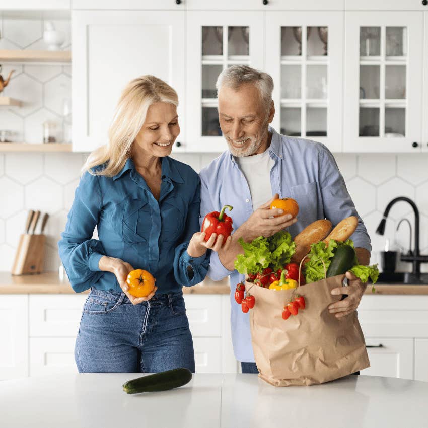 older couple unpacking healthy groceries