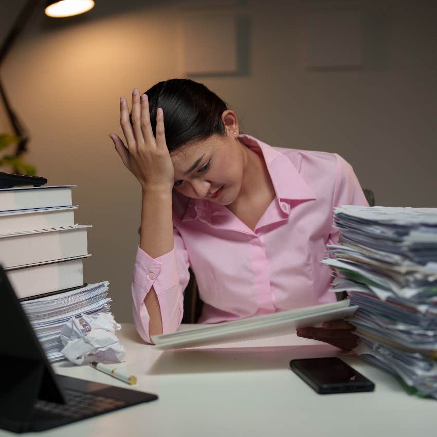 Overworked woman at job with relentless demands