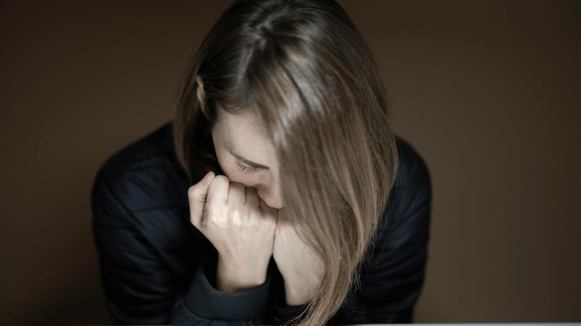 woman crying and alone