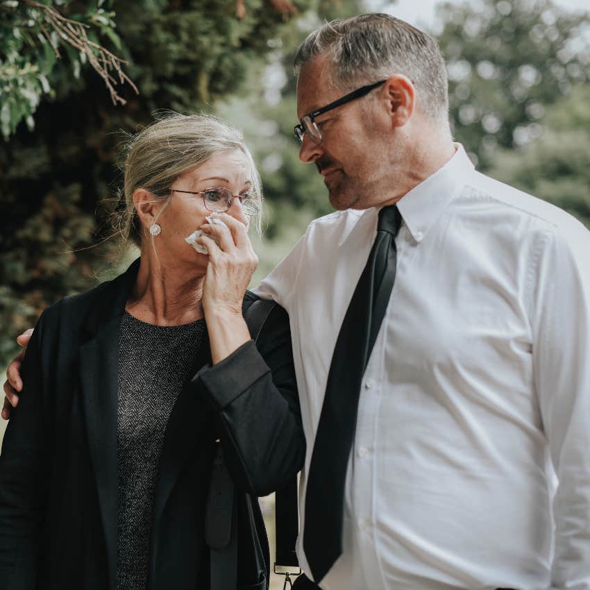 Parents crying over their daughter who's dying. 