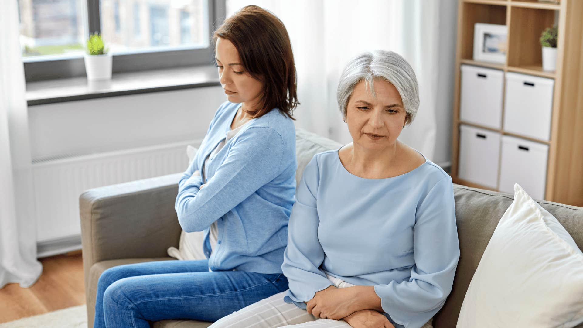 woman and her mom sitting on couch