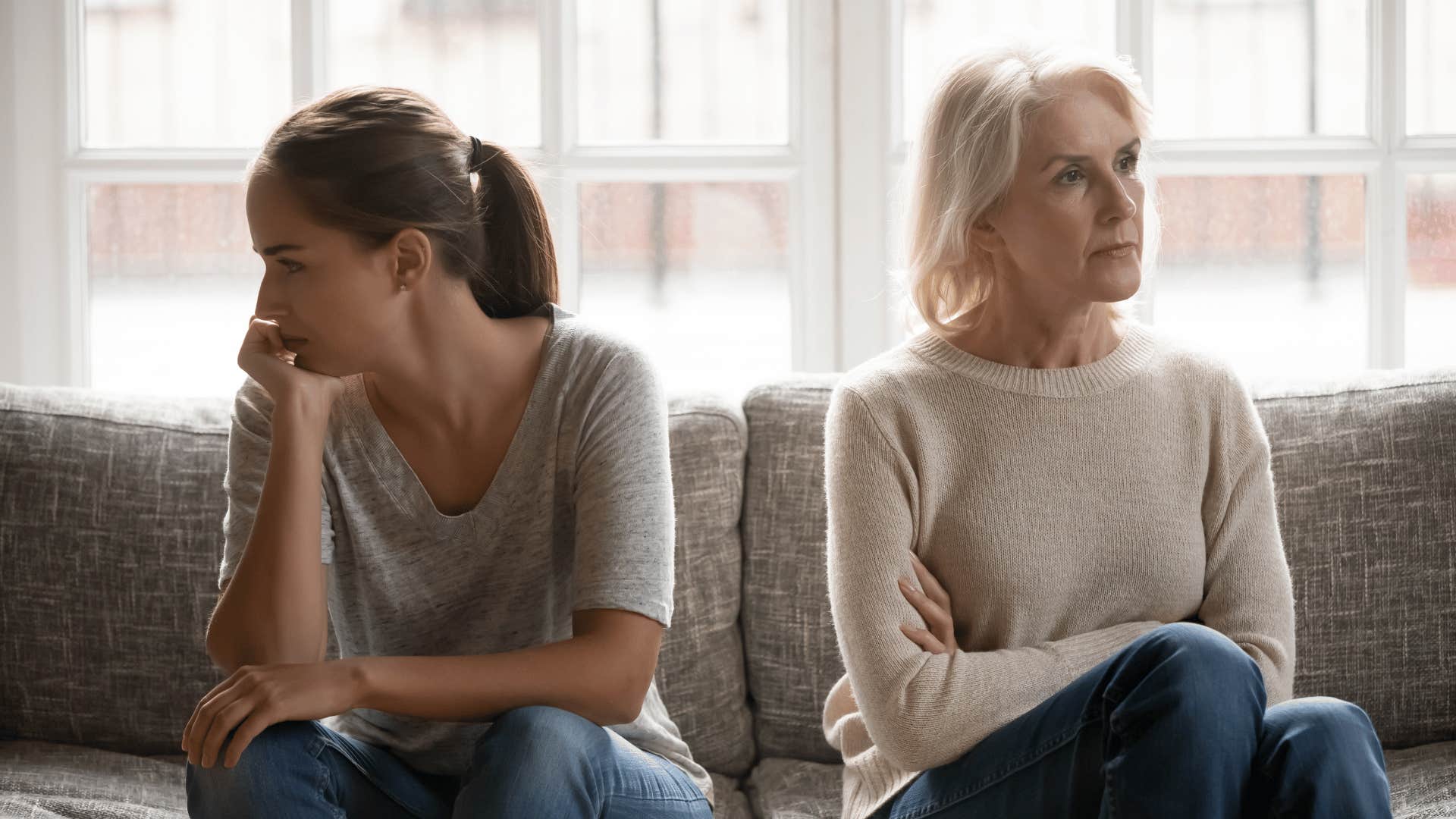 mom and adult daughter ignoring each other