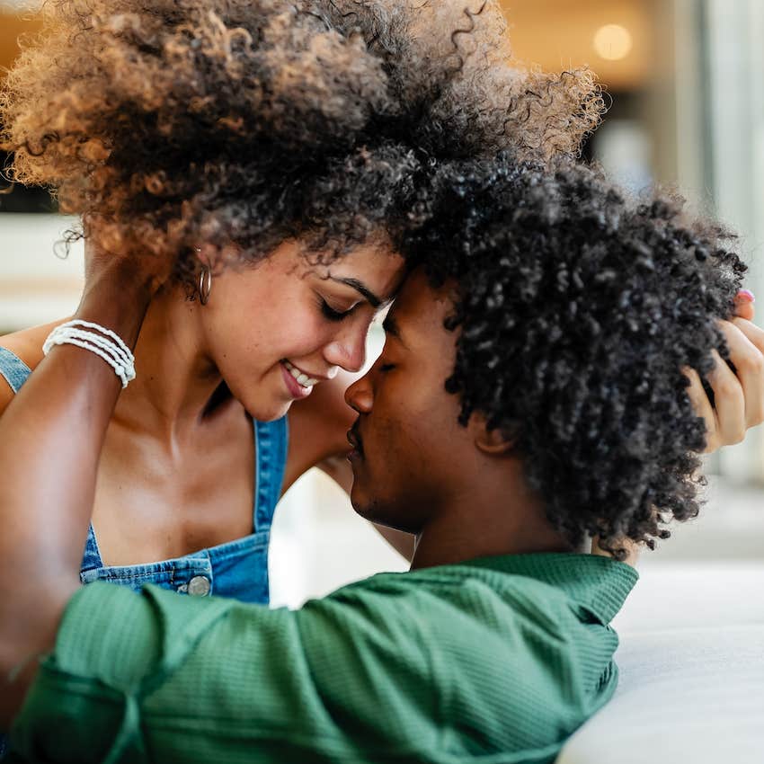 Loving couple touches faces, the tension just before a passionate kiss