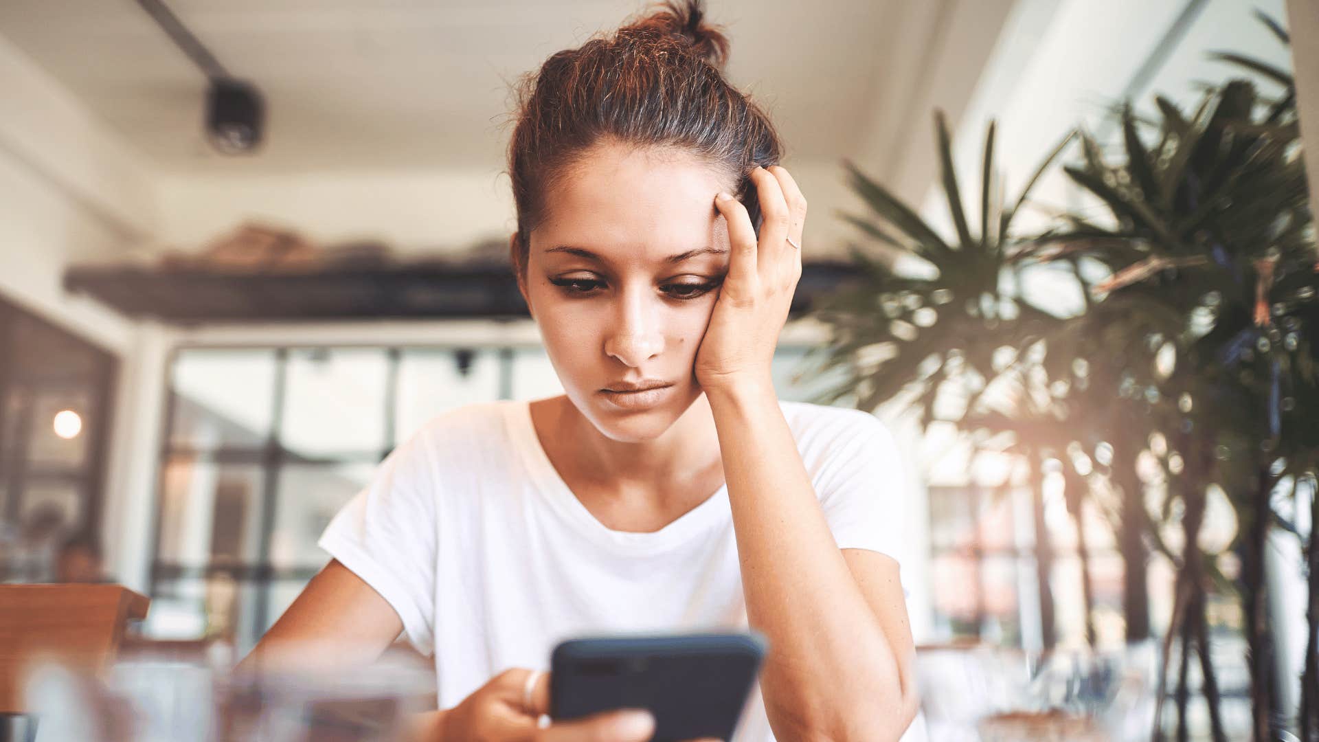 woman looking at her phone