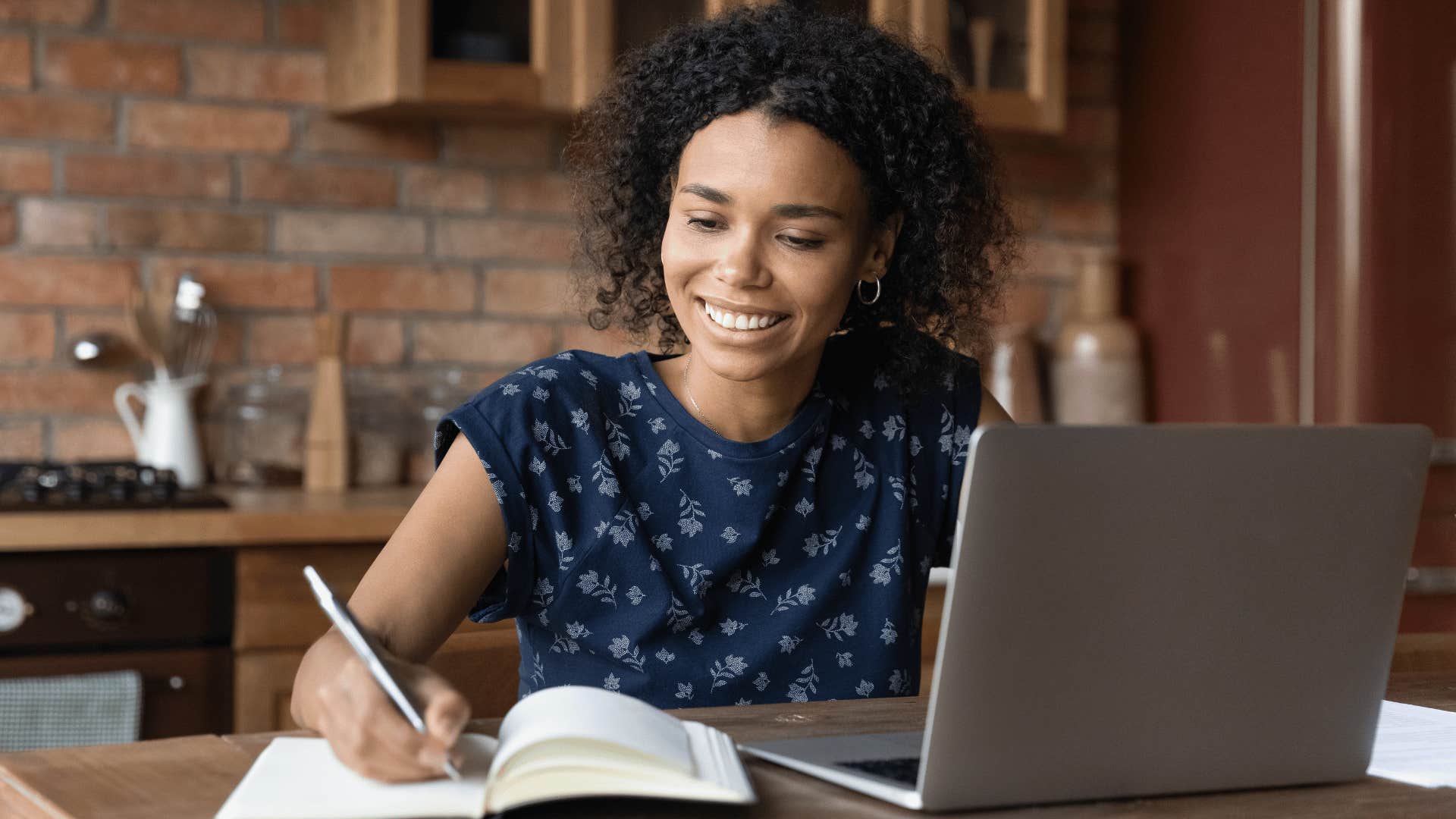 woman researching in kitchen 