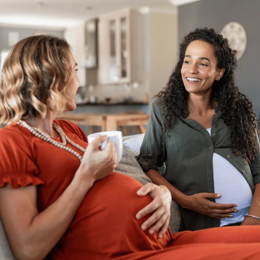 pregnant friends chatting on couch