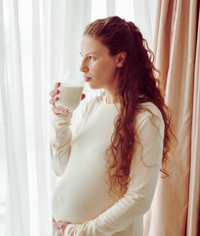 Pregnant woman drinking milk