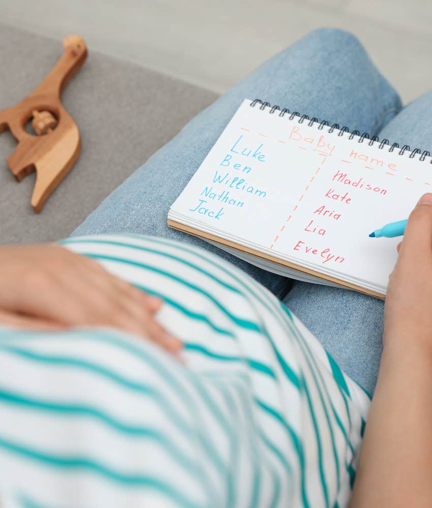 Pregnant woman with list of baby names