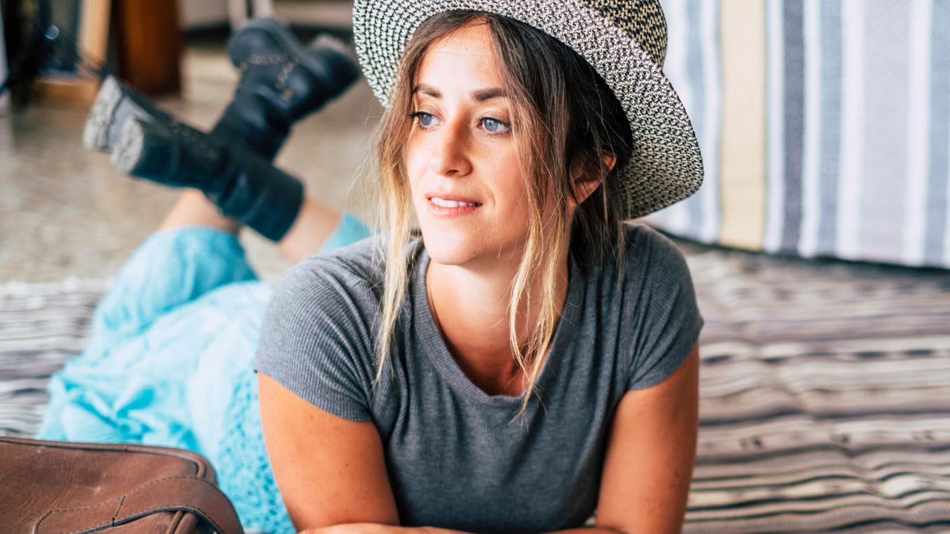 Woman working on breaking bad habits, making notes while reclining