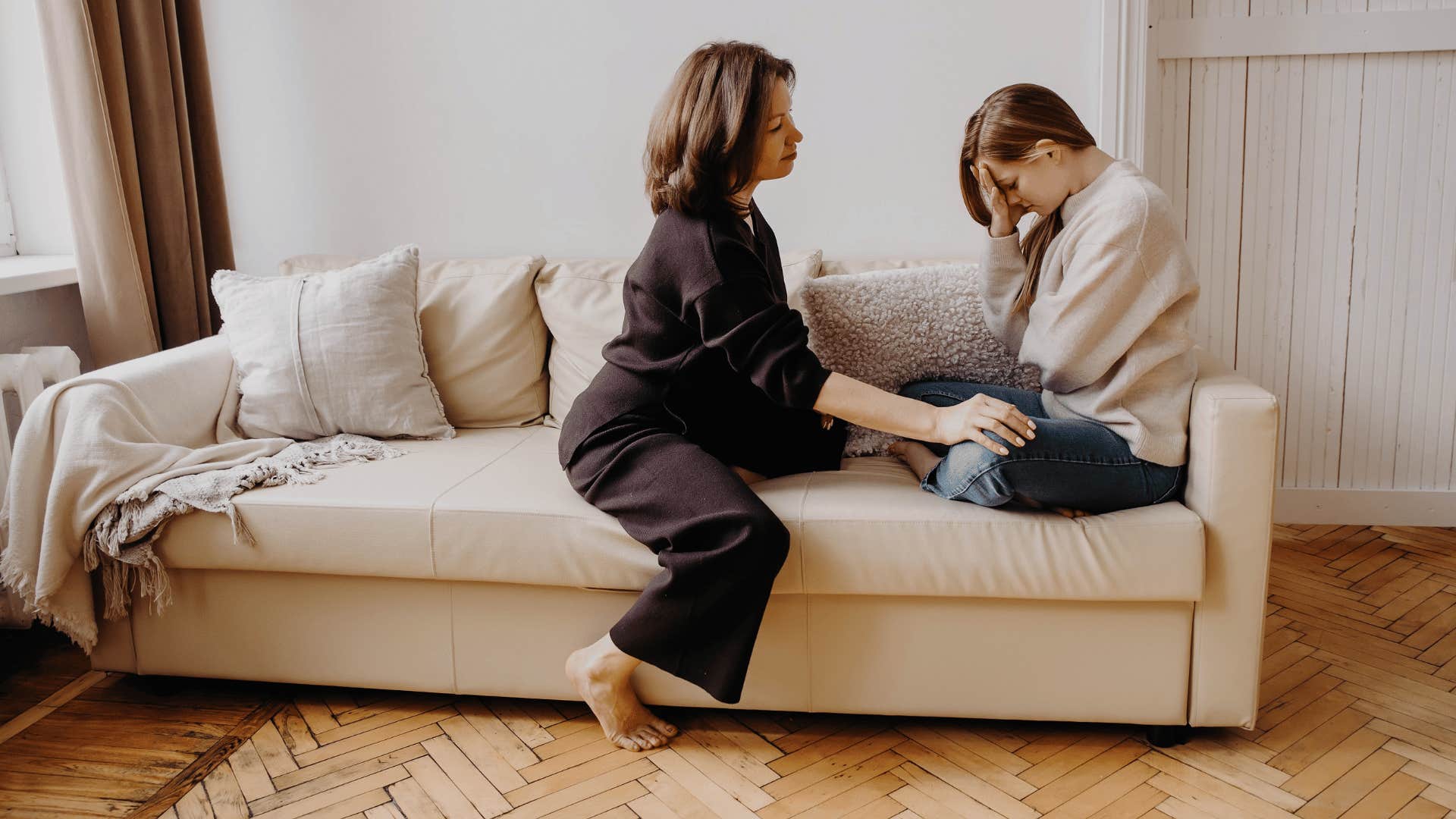 mom comforting daughter