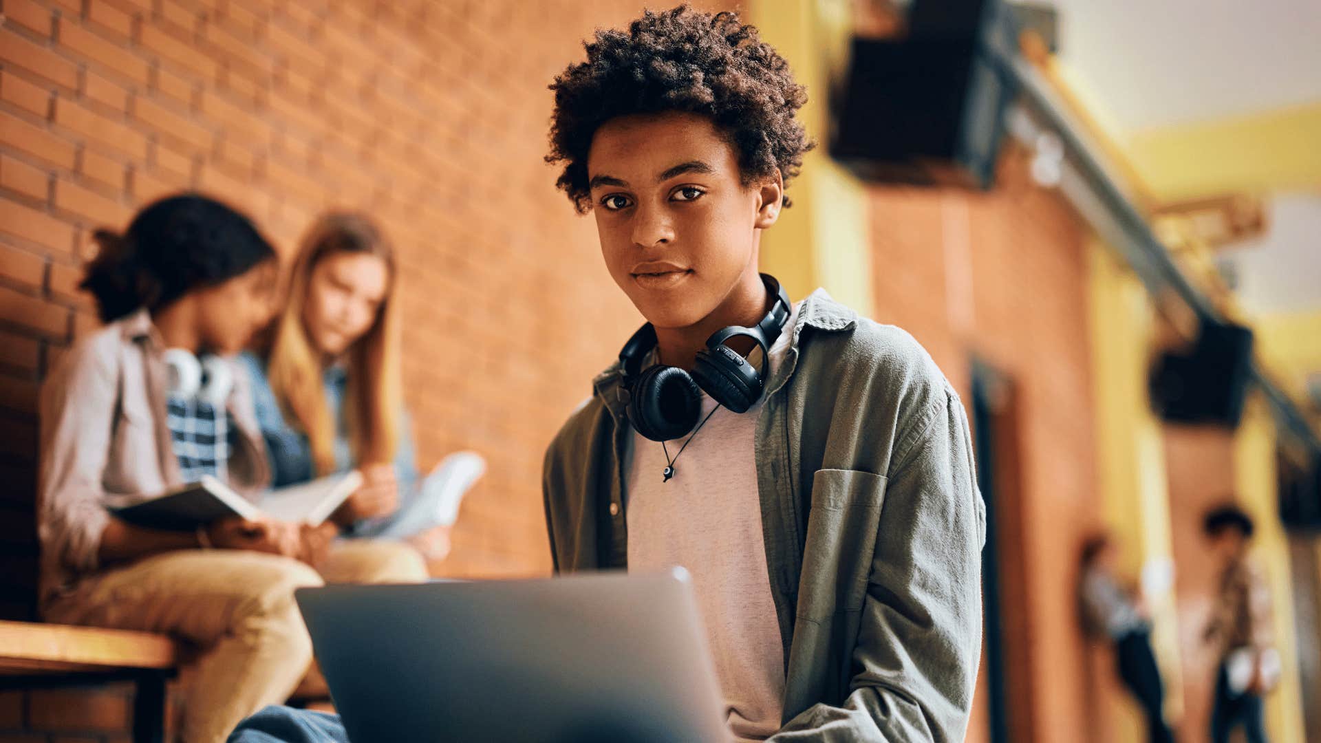 high school student on laptop