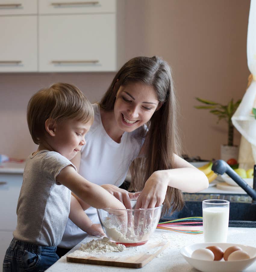 Woman and boy mix batter for baking