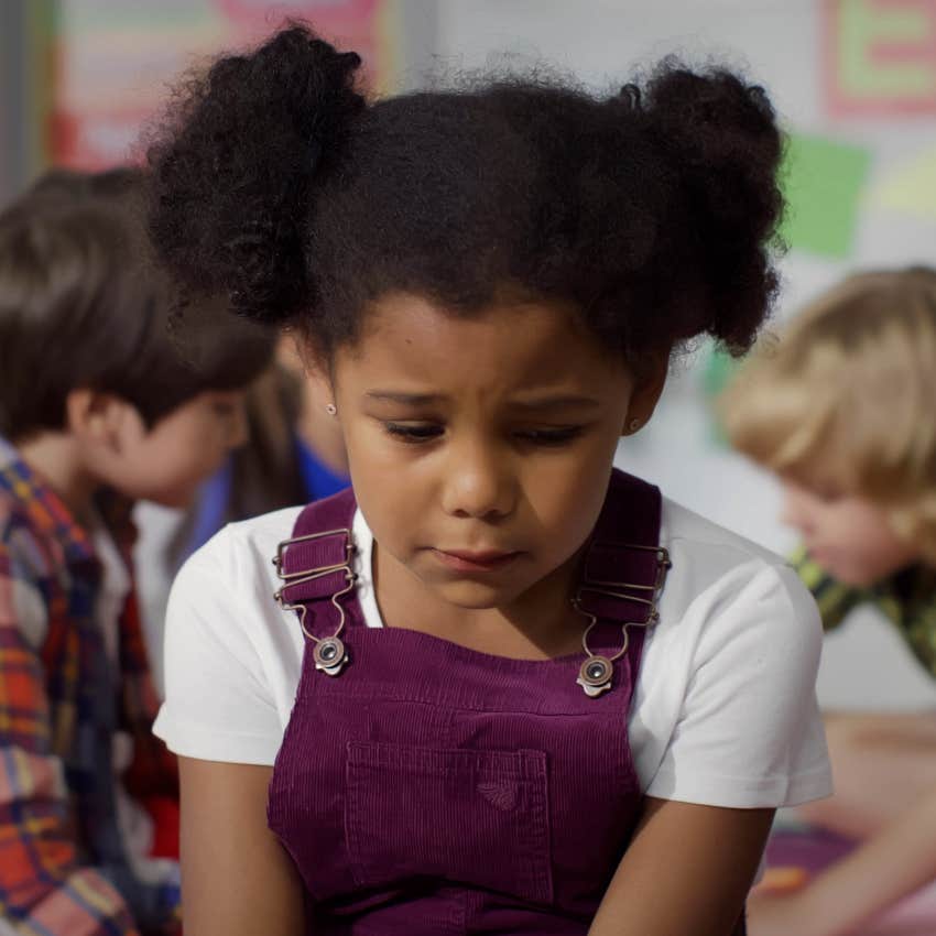 Sad little girl at daycare after lesson about 9/11