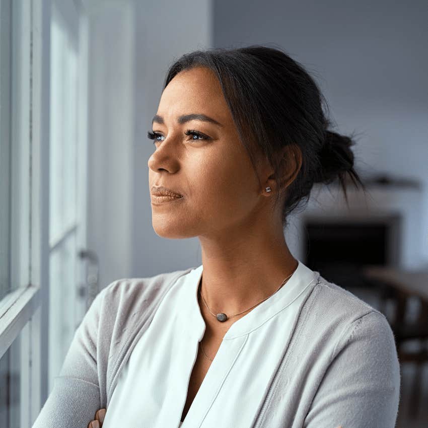 woman looking out the window