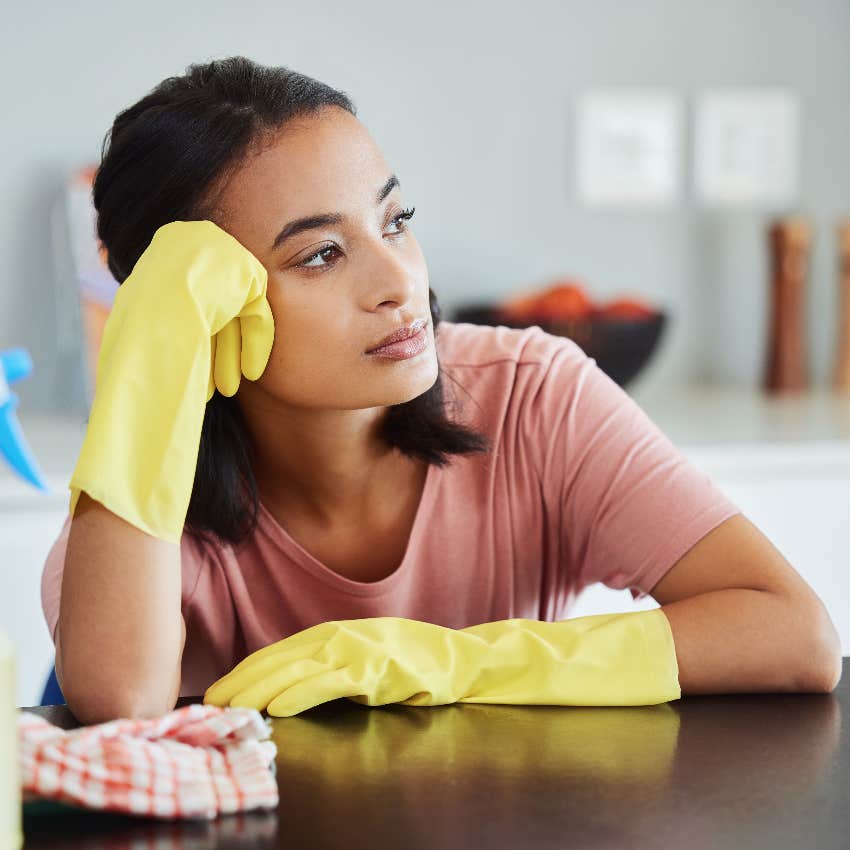 Sad wife cleaning for her own birthday party