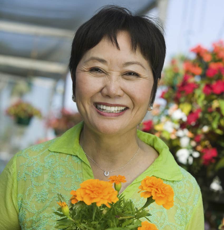 Happy woman with bouquet of flowers