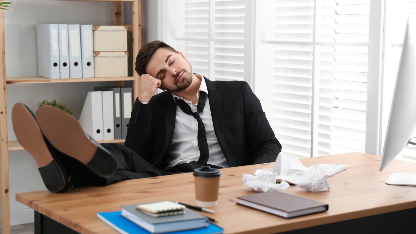 lazy worker sleeping at desk