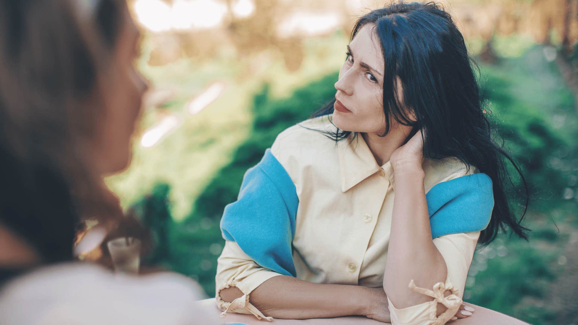 woman listening to another woman talk