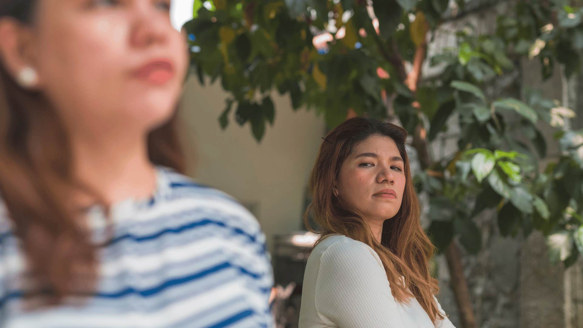 woman staring at another woman