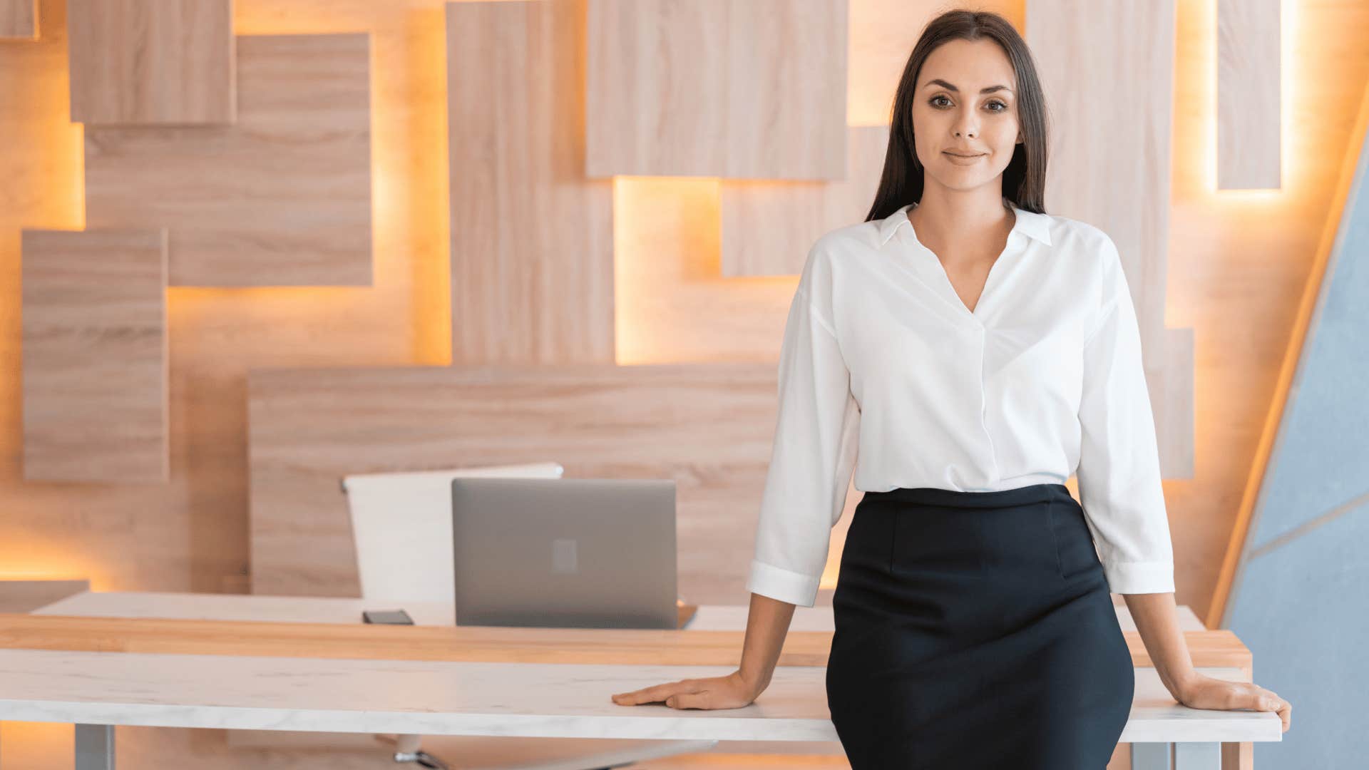 woman standing at desk 