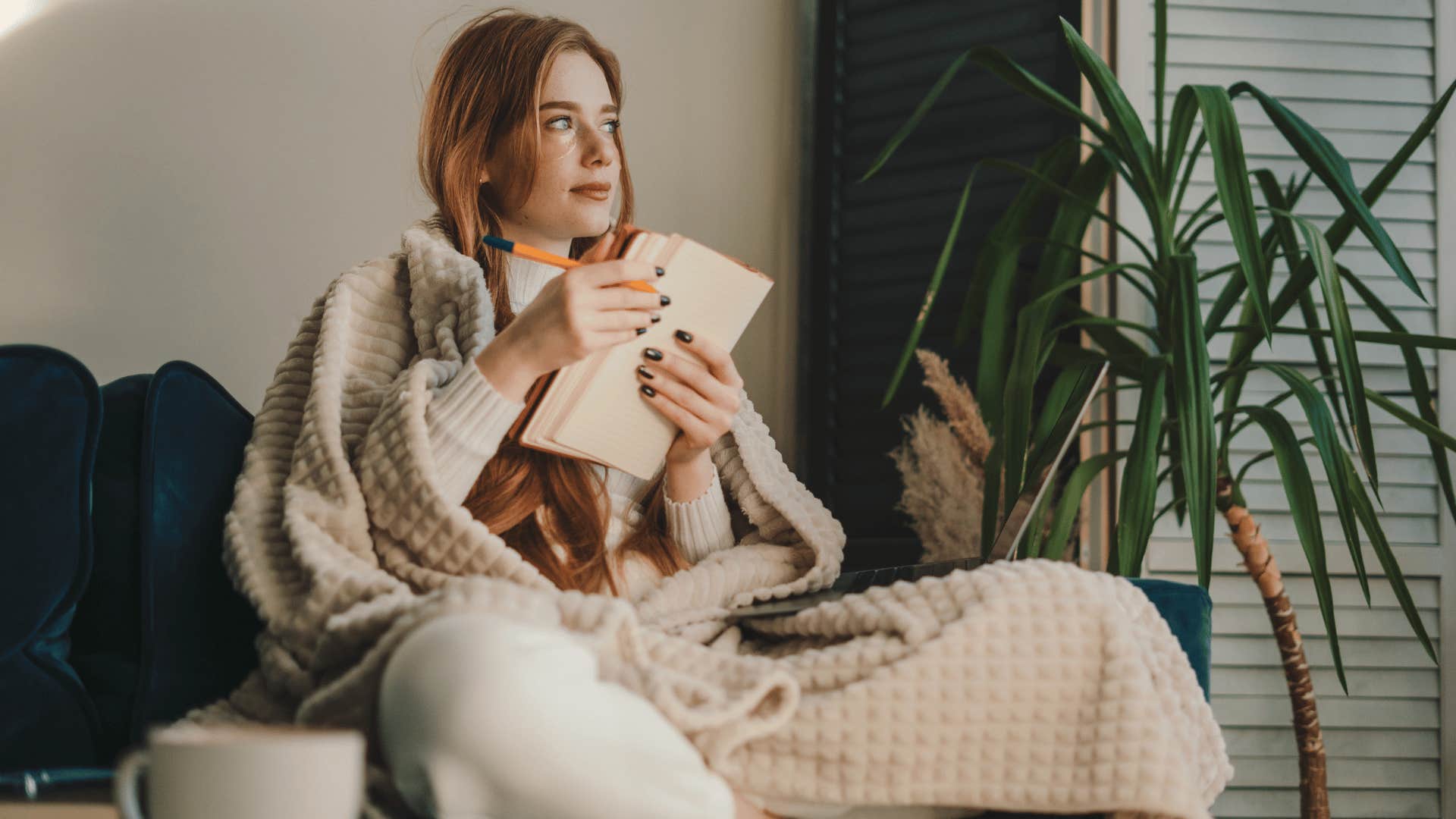 woman writing in journal 