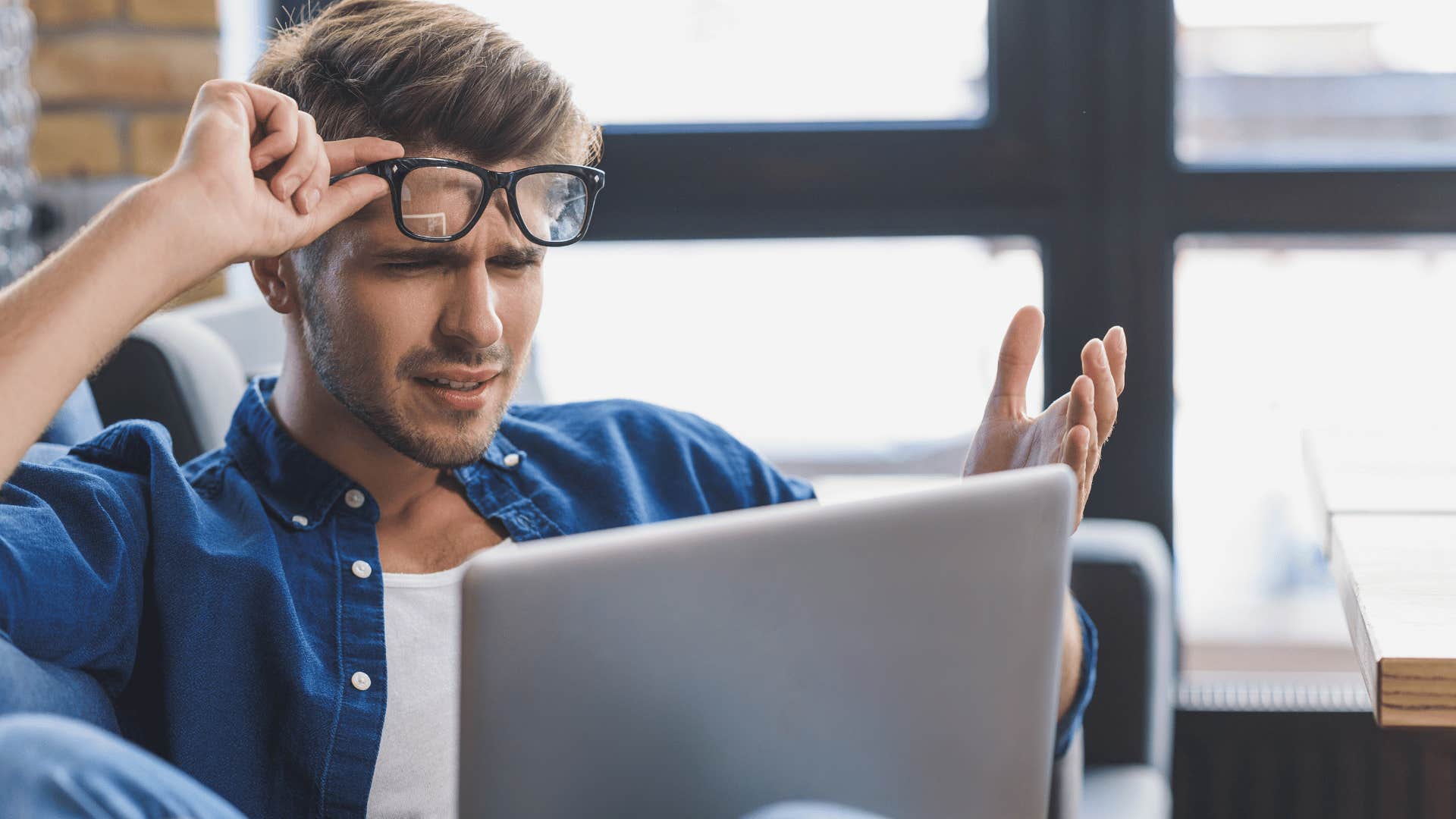 man looking at a computer