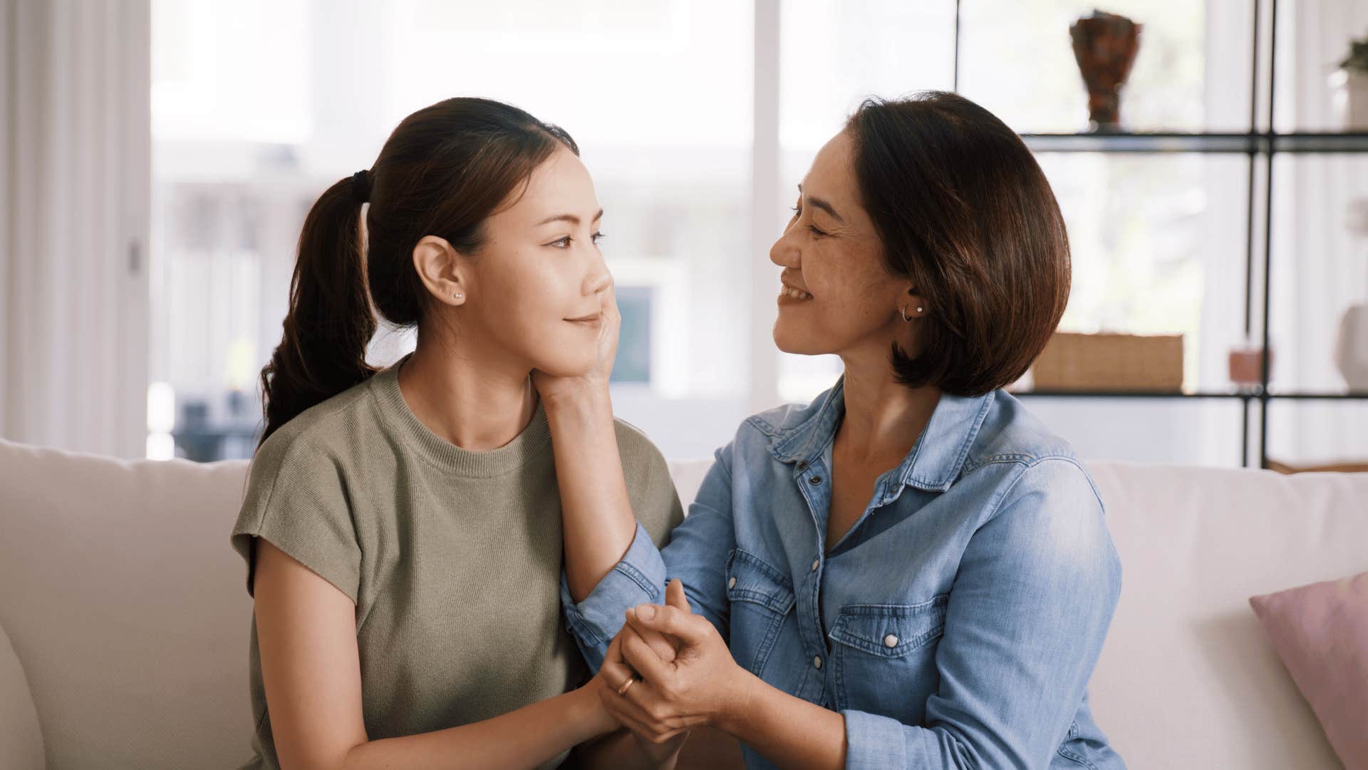 mom comforting daughter