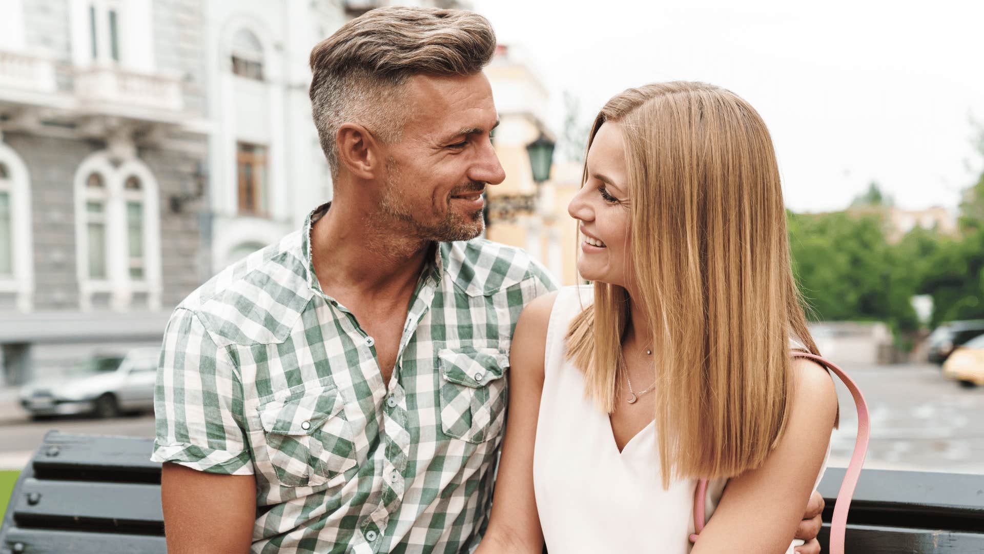 man and woman talking outside