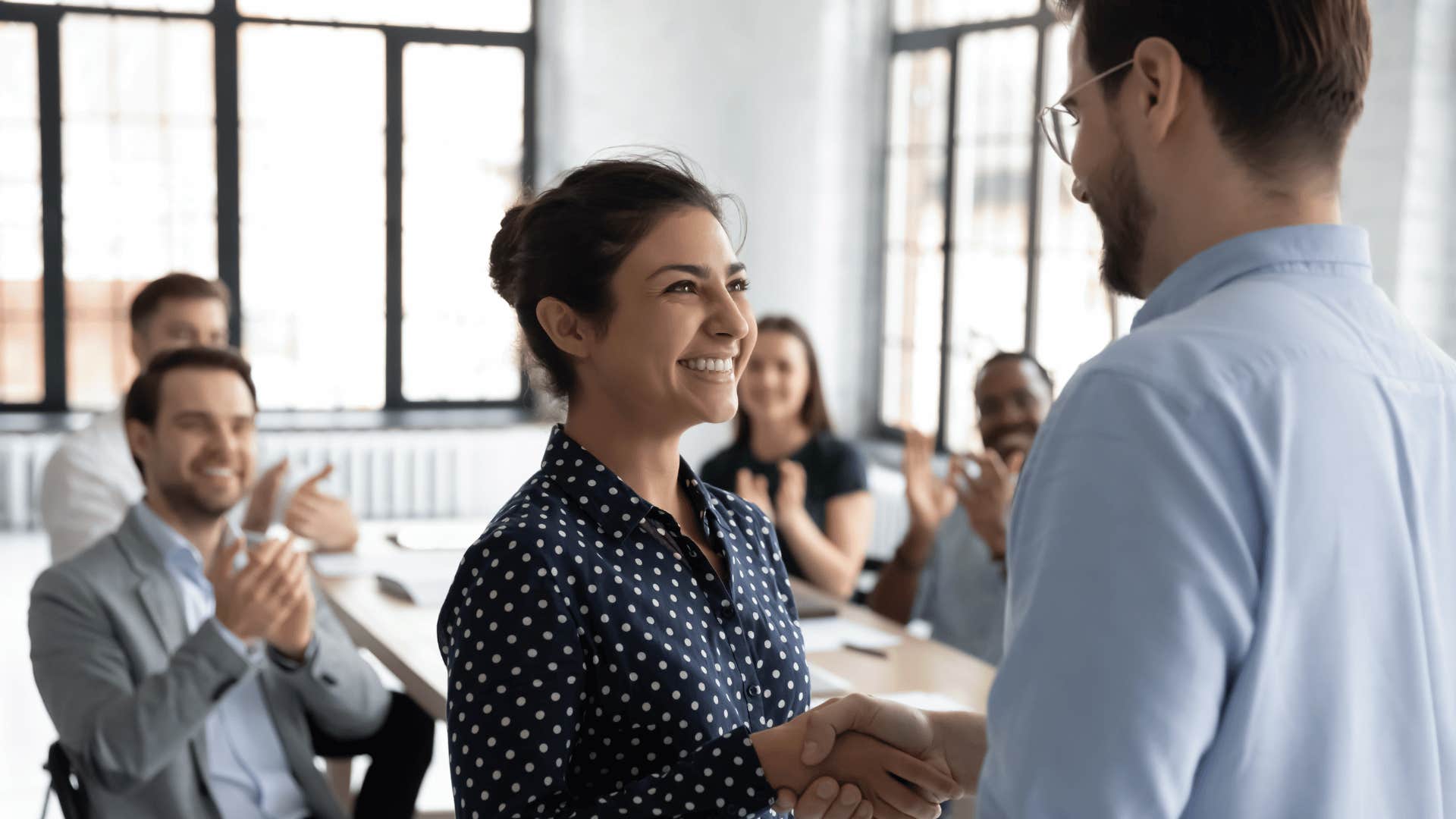 coworkers shaking hands