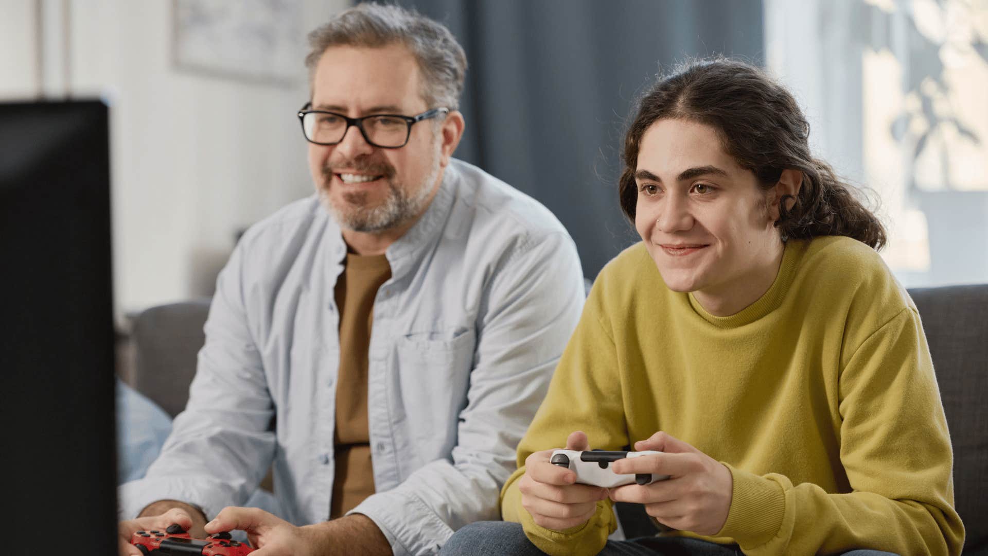 dad and son playing video games 