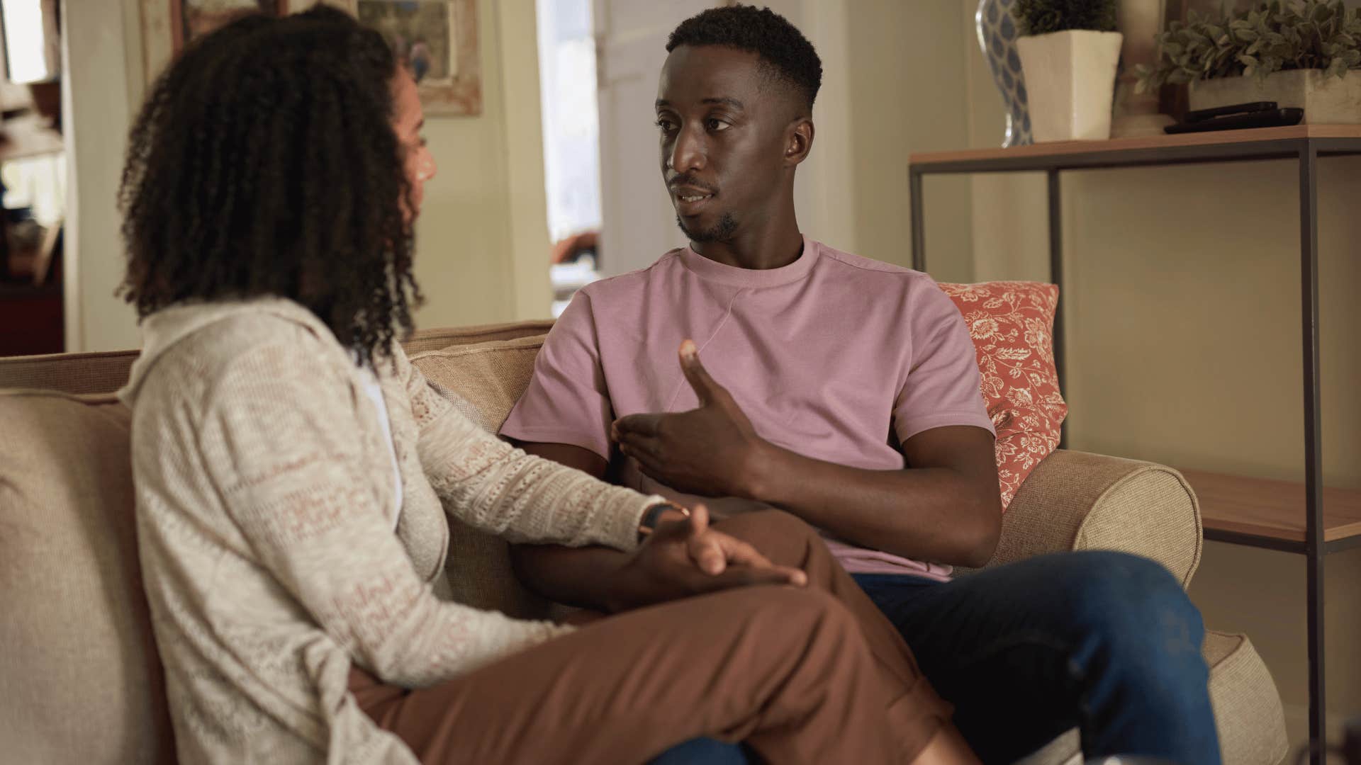 couple talking on couch