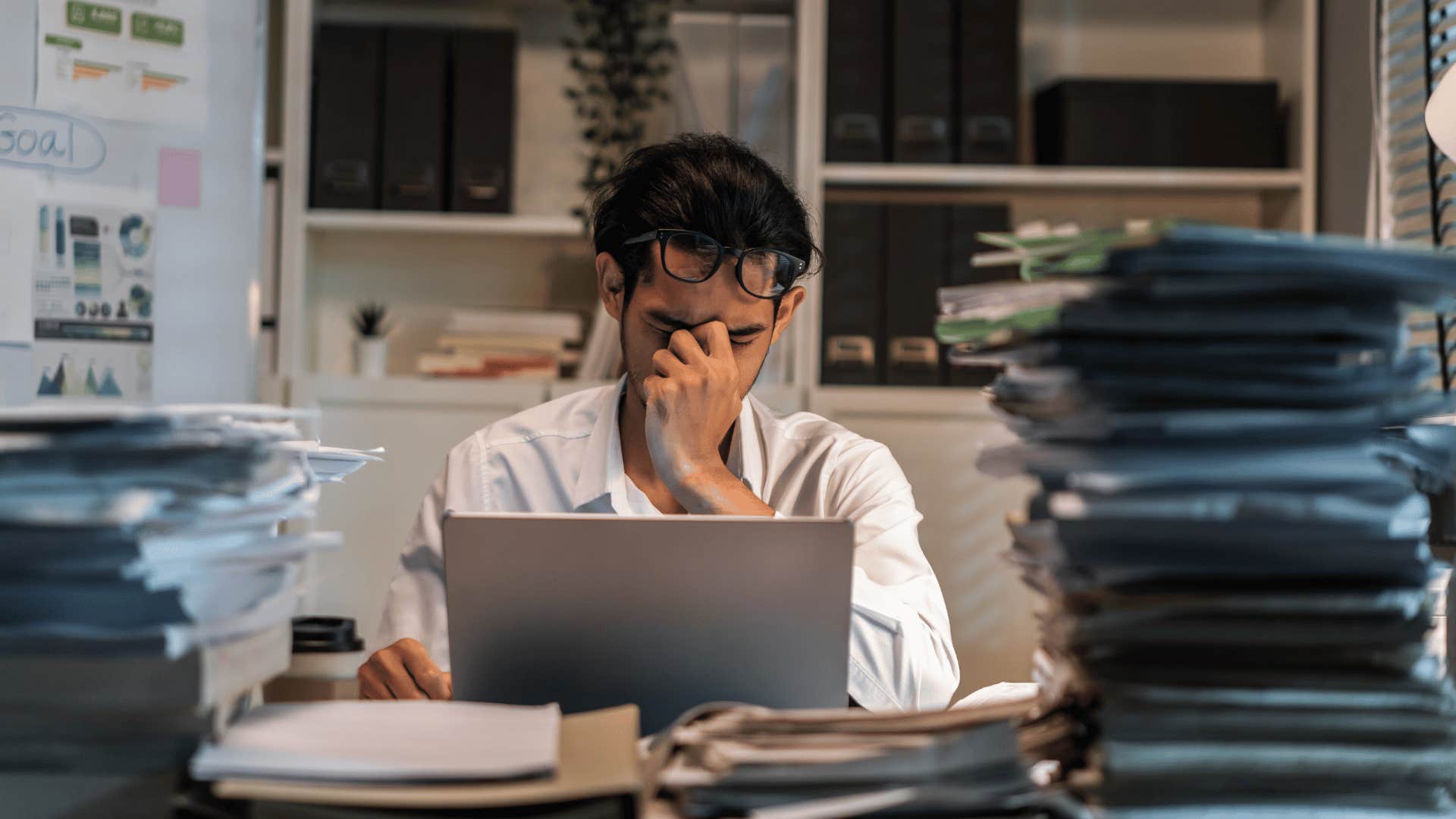 man working and looking stressed