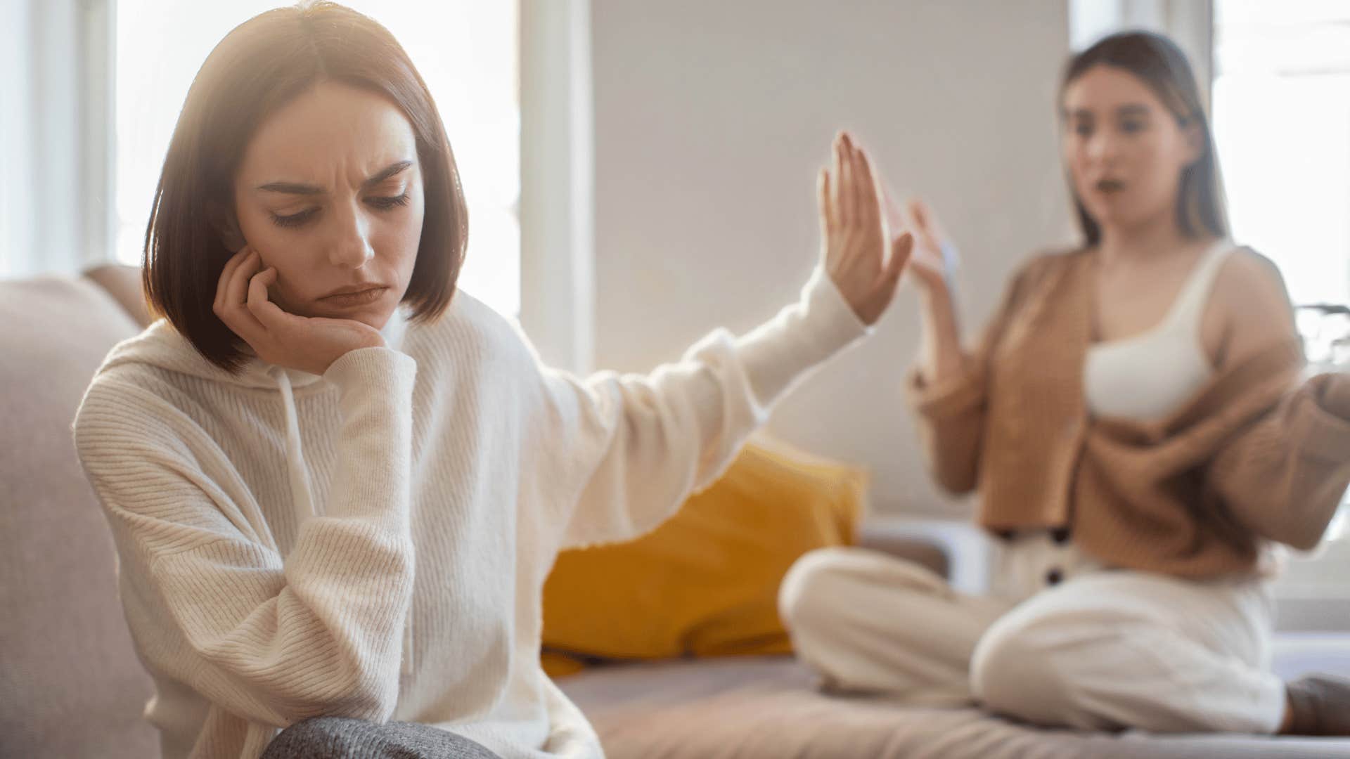 woman ignoring other woman